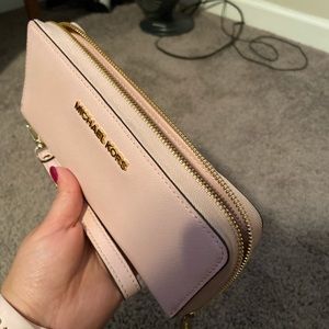 Michael Kors light pink wristlet with Gold zipper